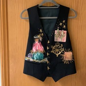 Hand painted vest with Native American designs.